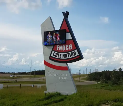 Welcome sign on the road into Enoch